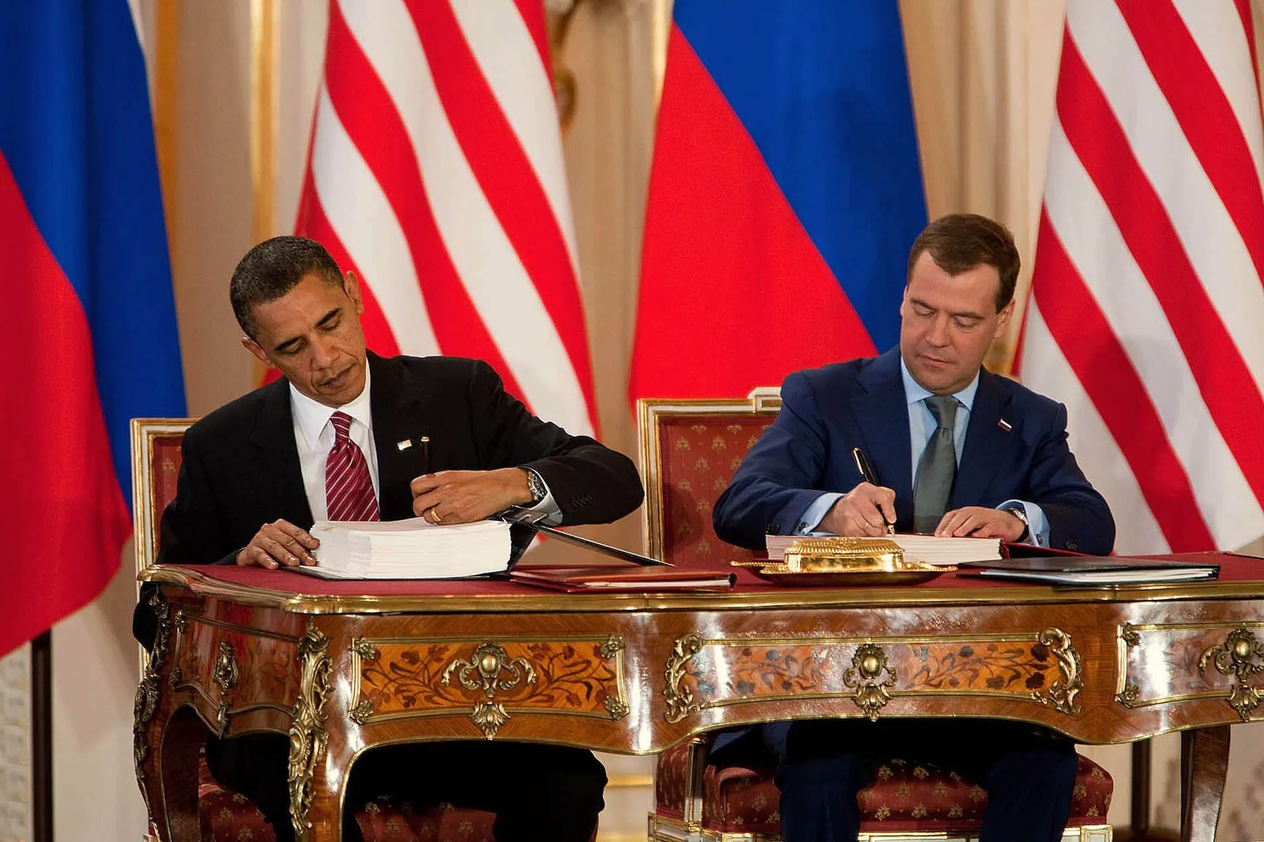 Obama and Medvedev sign New START — the heir of SORT — at Prague Castle, 8 April 2010. Photo: White House / Chuck Kennedy. Licence: public domain. Source: Wikimedia Commons https://commons.wikimedia.org/wiki/File:Obama_and_Medvedev_sign_New_START.jpg